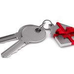 Two keys and trinket house on white background. isolated 3d illustration